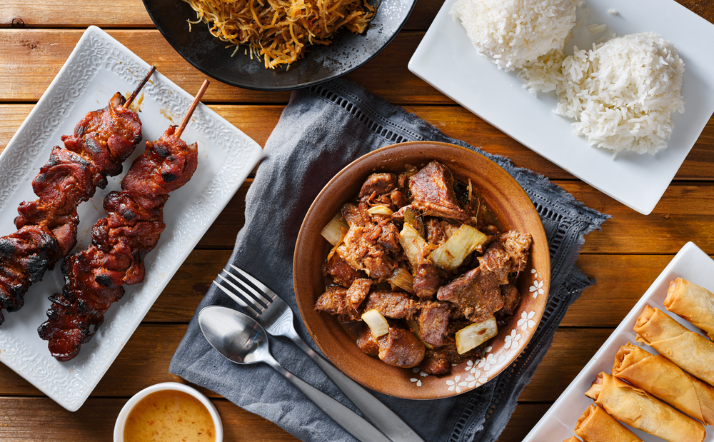 A table with various Filipino dishes