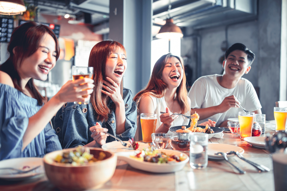 Friends exploring new restaurants in Singapore
