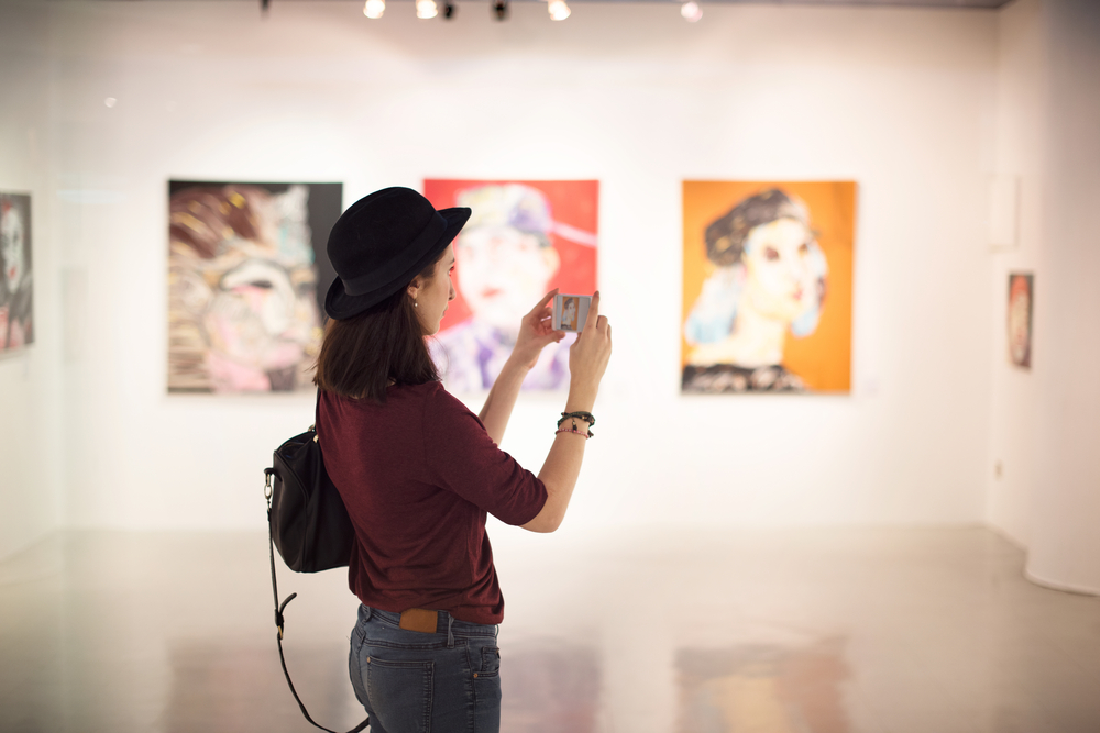 A woman exploring an art gallery in KL