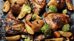 Grilled chicken meat on baking sheet